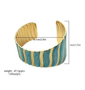 Detail of gold-plated stainless steel cuff bracelet with size and weight measurements