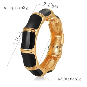 Productafmetingen van de verstelbare zwart geëmailleerde goud vergulde bamboe armband.
