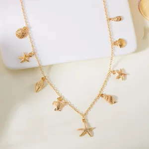 Detailed close-up of gold starfish and seashell charms on a beach vacation necklace
