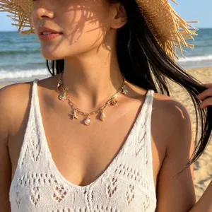 Gold marine charm necklace with starfish and shells for beach vacation style