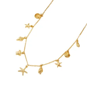 Elegant gold necklace featuring starfish seashell and turtle charms for beach style