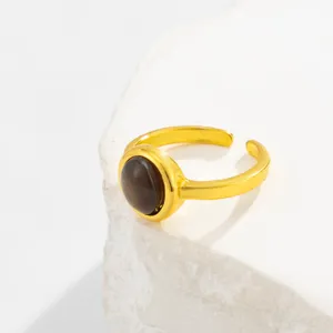 Vintage gold plated adjustable open ring featuring a polished round tiger eye gemstone