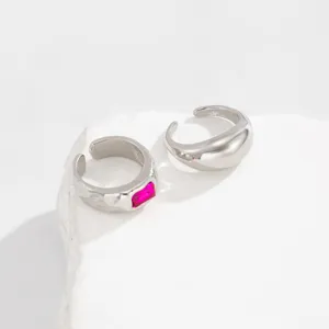 Vintage silver geometric ring set with pink gemstone and polished band.