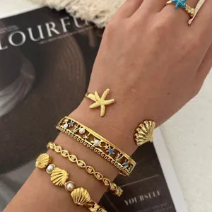 Goldenes Seestern und Muschel Armband Set aus Edelstahl für den Ozean Urlaubslook