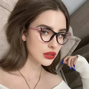 Detailed view of a woman wearing stylish vintage cat-eye blue light blocking glasses