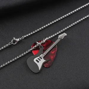Detailed view of stainless steel guitar and red pick pendants on a silver chain