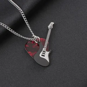 Close-up detail of stainless steel guitar and red heart pick pendant necklace for music fans.