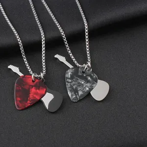 Close-up of rock guitar pick pendants with stainless steel music charms