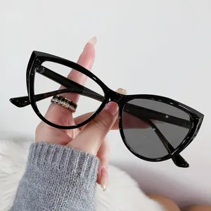 Retro cat-eye photochromic glasses with anti-blue light showing clear and dark lens contrast