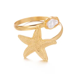 Elegante bracciale da braccio regolabile con stella marina dorata e dettaglio perla