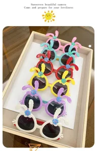 Assortment of colorful children's bunny ear sunglasses presented in a display tray