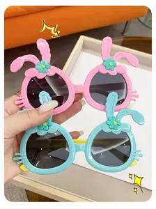 Detail showing cute pink and blue rabbit-eared cartoon sunglasses for little girls fashion
