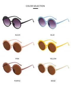 Children's round sunglasses with flower appliques displayed in six assorted vibrant colors