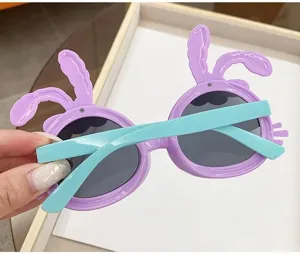 Close-up view of cute purple rabbit ears sunglasses for kids with turquoise temples