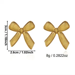 Vintage stainless steel gold bow earrings showing 3cm height and 2.6cm width specifications