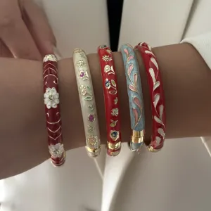Retro Chinese style enamel bangle set featuring intricate floral and leaf designs.