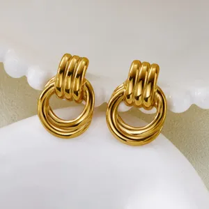 Detailed macro shot of vintage gold multi-ring earrings made of durable stainless steel