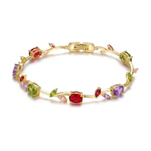 Elegant gold-plated leaf vine bracelet with vibrant multi-colored gemstones on white background