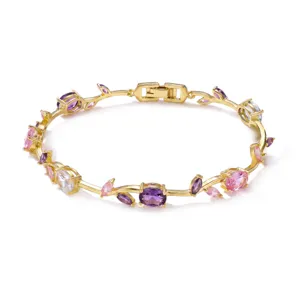 Elegant gold-plated vine bracelet with purple and pink crystals and leaf motifs.