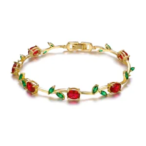 Elegant gold-plated vine bracelet featuring red oval and green leaf-shaped gemstones