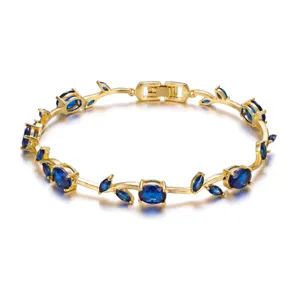 Elegant gold-plated leaf vine bracelet featuring brilliant blue gemstones for women