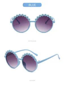 Front and side view of cute light blue round children's sunglasses with flower detail.