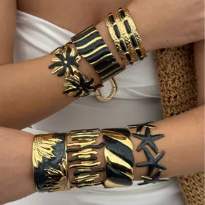 Edelstahl Armreifen in Gold und Schwarz mit Sonnenblumen- und Seestern-Motiven