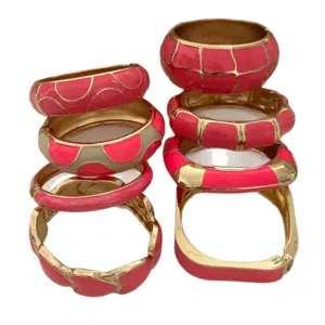 Stackable set of vibrant rose pink enamel bangles with gold-toned geometric patterns for women