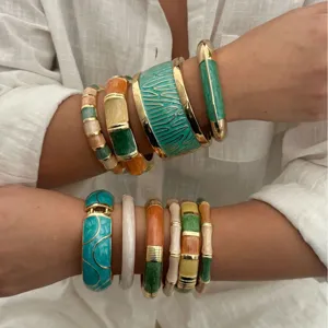 Bohemian colorful enamel bangles set featuring vibrant vacation style on a model's wrists