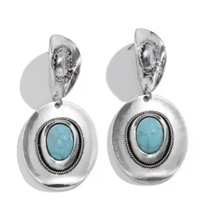 Vintage Bohemian silver-tone hat earrings with polished turquoise stones detail