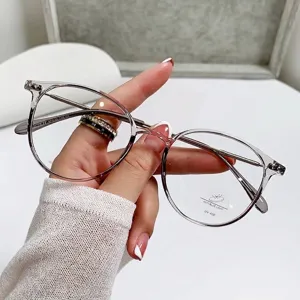 Modern transparent tea-colored anti-blue light glasses for women with round frames