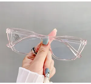 Detailed view of stylish transparent pink cat-eye glasses with anti-blue light lenses.