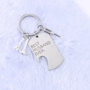 Detail of stainless steel dog tag keychain with 'BEST HUSBAND EVER' engraving and tool charms