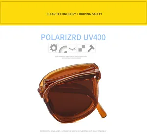 Detailed macro view of foldable amber sunglasses featuring UV400 polarized lenses for safety