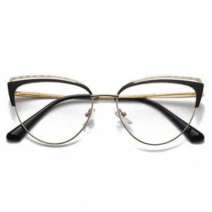 Gafas de diseño cat-eye bloqueadoras de luz azul en negro y dorado de metalizado