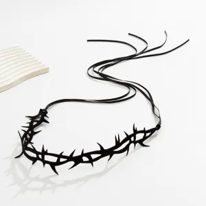 Detailed view of gothic black thorn choker with elegant ribbon ties on white base