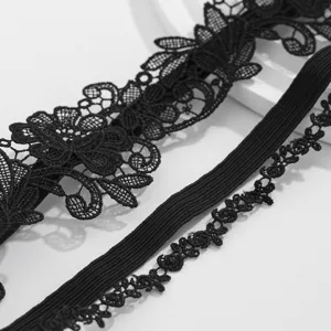 Detailed macro view showing the intricate black floral lace and elastic band of this Gothic leg ring
