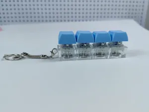 Portachiavi con interruttore meccanico e quattro tasti blu antistress da ufficio