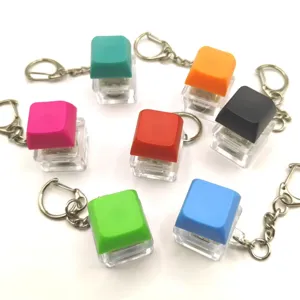 Detailed view of colorful mechanical keyboard switch fidget keychains with transparent bases