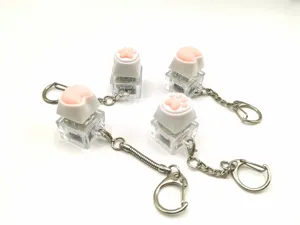 Detailed view of cute cat paw and corgi butt light-up decompression button keychains