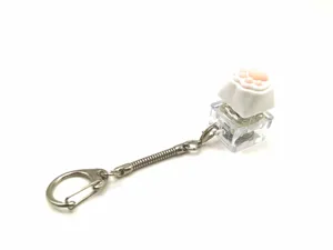 Detail view of cute pink silicone cat paw mechanical switch fidget toy keychain pendant