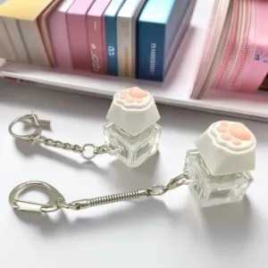Cute pink and white cat paw mechanical switch fidget keychain for desk stress relief