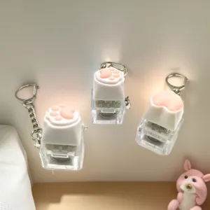 Cute cat paw and corgi butt mechanical switch fidget keychain with glowing LED light effect.