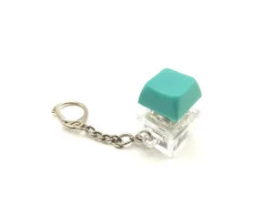 Mechanical keyboard switch fidget keychain with turquoise keycap and clear base