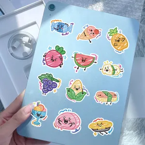 Detailed shot of various cute food-themed graffiti stickers on a blue tablet device