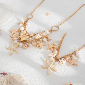 Close-up detail of bohemian summer beach seashell and starfish necklace with pearls