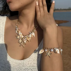 Bohemian beach style necklace and bracelet set with sea shells and starfish charms