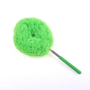 Detail shot of the green microfiber telescopic cleaning duster brush head and metal handle.