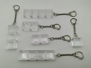 Detailed view of clear mechanical keyboard switch tester keychain bases with 1 to 4 slots