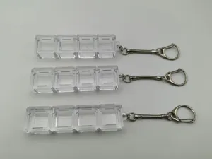 Close-up view showing three 1x4 transparent mechanical keyboard switch tester keychains